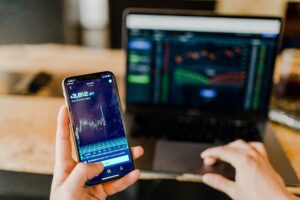 phone and laptop investing